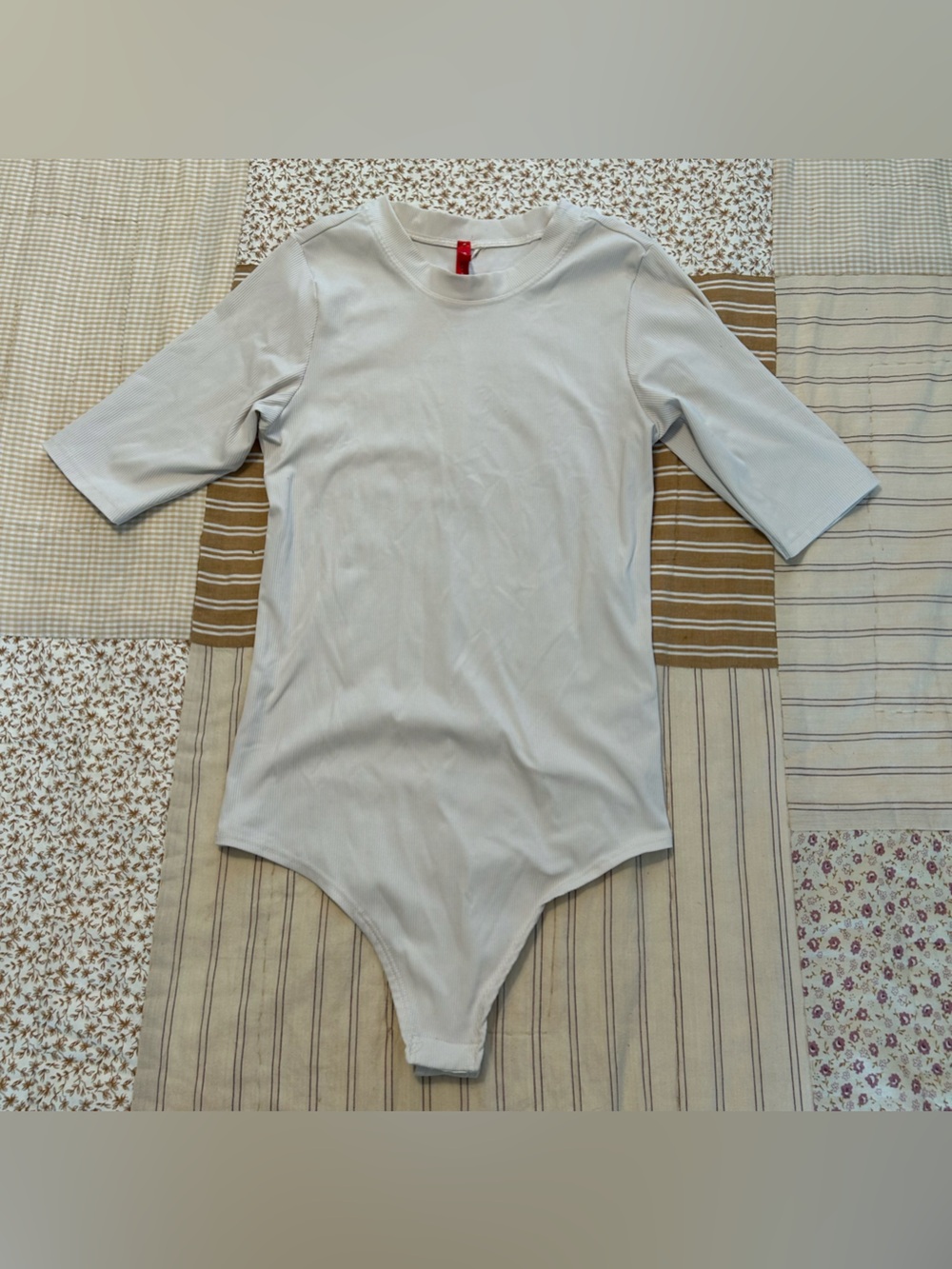 Women’s cream spanx bodysuit size xs